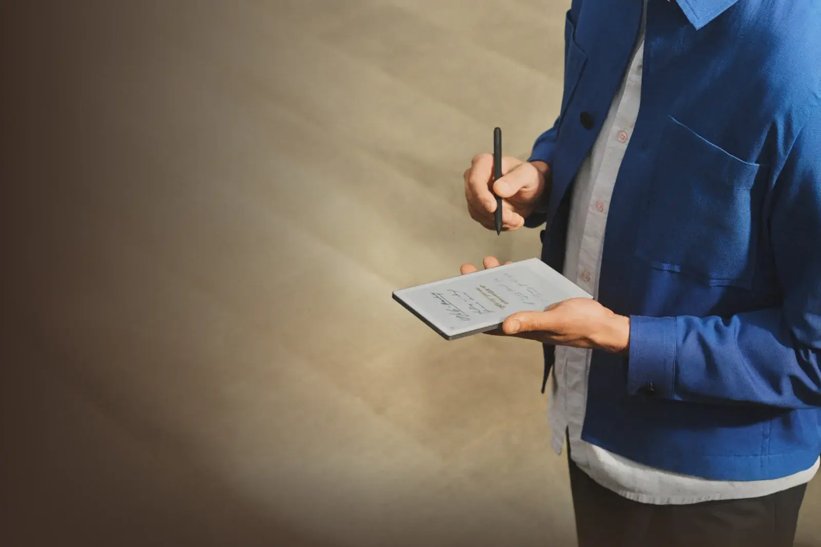 Person holding reMarkable Paper Pro Move outdoors